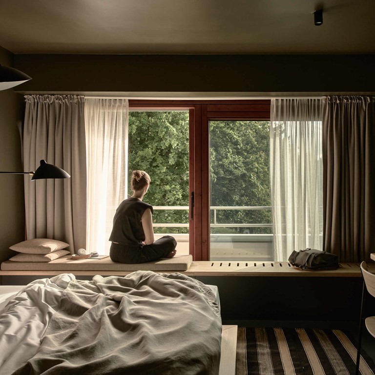 bold campus bold room open window woman sitting totale